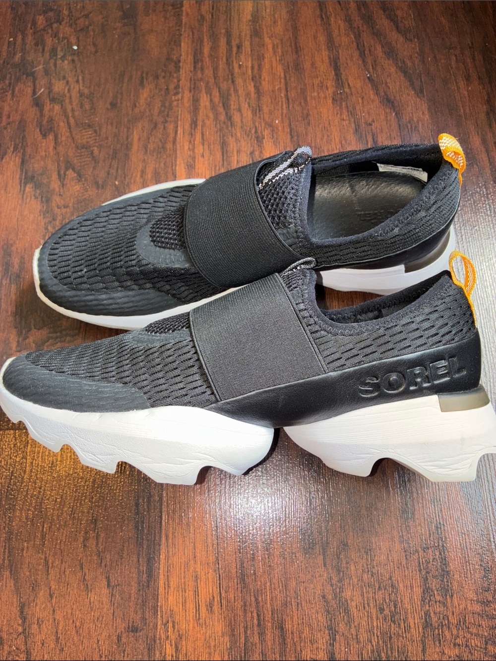 Sorel Black Slip-On  Knit Sneakers with White Sole and Orange Pull Tab
